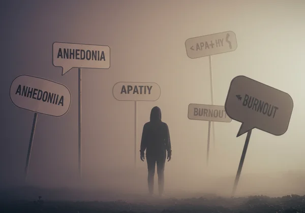 Person navigating a confusing emotional fog with labels